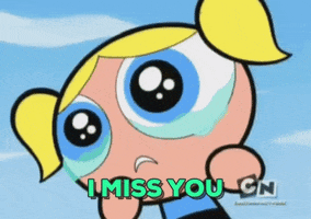 TV gif. Bubbles from Powerpuff Girls says "I miss you" while tears well up in her eyes.