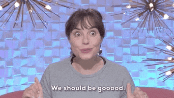 Reality TV gif. A talking head of Brittany from Big Brother season 24, thumbs up, eyes wide with equivocation, saying "we should be goooood."