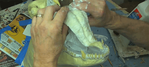 man creating a paper mache