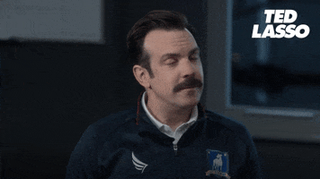TV gif. Jason Sudeikis as Ted Lasso shakes his head with enthusiasm, affirming "Yeah, let's do it!"