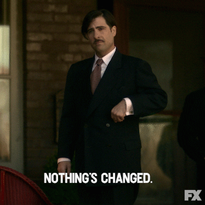 A man in a suit shrugging with the caption 'Nothing's changed'