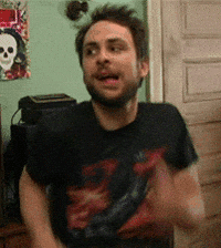 TV gif. Charlie Day as Charlie on It's Always Sunny in Philadelphia bites his lip, smiling and looking to the side while swinging his shoulders and pumping up his arms excitedly.