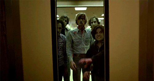 A GIF of a group of zombies lunging at the screen as elevator doors open.