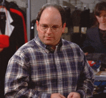 Seinfeld gif. Jason Alexander as George looks nervous as he brings his hand to his mouth then slowly slides it down his chest.