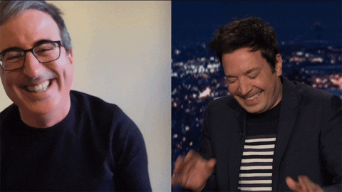 Gif of an interview where Oliver is appearing remotely. In the left image, Oliver is laughing and covers his mouth. In the right image, Fallon laughs and waves his hands in a ''no more'' gesture before putting his right hand to his temple.