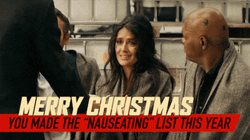 Movie gif. Ryan Reynolds as Michael Bryce in Hitman's Wife's Bodyguard sits by Salma Hayek as Sonia Kincaid clutches a letter to her chest and Samuel L. Jackson as Darius Kincaid who gives him a death stare. Text reads, "Merry Christmas, you made the 'nauseating' list this year."