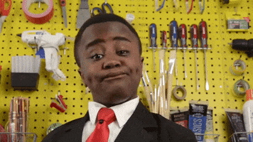 Video gif. In front of a pegboard wall of tools, Kid President from Kid President's Important Message to Dads bobs and nods with a lighthearted expression.