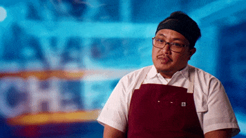 Reality TV gif. A talking head of Zachary Adams from Next Level Chef unaffectedly declaring "Oh, it's hell down here."