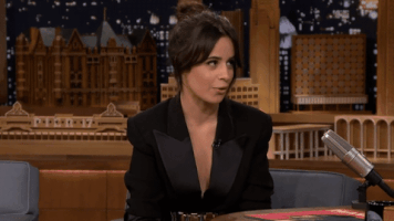 TV gif. Camila Cabello on late night television turns from the host to look at the audience, raising her hands in a shrug, saying, "I don't know how"