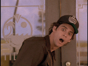 Movie gif. Jim Carrey as Ace Ventura wears a delivery man uniform. He leans forward then settles back with an exaggerated eye roll like he recognizes he made a silly mistake. 
