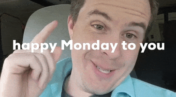 Video gif. A man smiles and points at us and says, "Happy Monday to you."