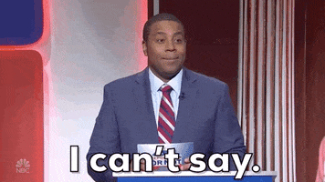 SNL gif. Kenan Thompson plays a game show host. He stands behind a podium with a stack of cards in his hands. He shrugs his shoulders and laughs as he says, “I can’t say.”