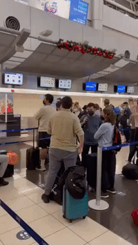 Passengers Gather at Costa Rica Airport Amid Christmas Eve Flight Disruption