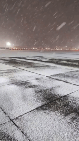 Gatwick Airport Covered in Snow Causing Flight Cancellations