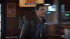TV gif. Andy Samberg as Jake Peralta on Brooklyn Nine-Nine goes up to a bar and without even looking at him, high fives Joe Lo Truglio as Charles Boyle. Charles does a small spin as he high fives Jake.