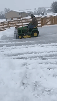 Fiance Straps a Box to His Lawn Mower to Create a Genius DIY Snow Plow
