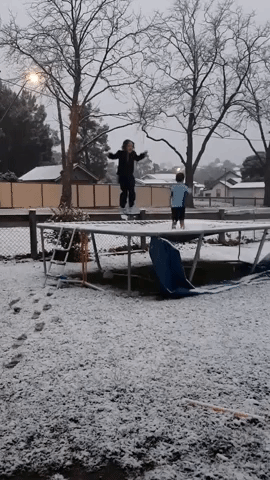 'Excited' Kids Bounce on Snow-Covered Trampoline as Cold Snap Brings Wintry Weather to New South Wales