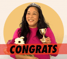 Video gif. A woman wearing a tiara holds a small trophy and a bouquet, smiling proudly. Text, “Congrats.”