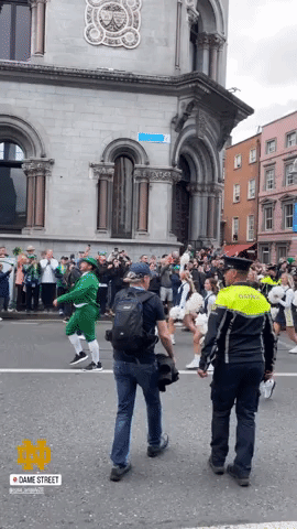 Crowds Line Dublin Street For Parade Ahead of Notre Dame Football Game Against Navy