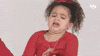 Video gif. A curly-haired little girl leans away from something she clearly thinks is gross.