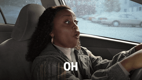 TV gif. Quinta Brunson as Janine in Abbot Elementary drives a car in the rain, both hands on the steering wheel and looking straight ahead at the road. She says, "Oh."
