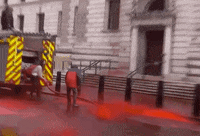 red london protest fake blood climate protest GIF