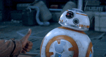 Star Wars gif. Panel on BB-8's belly opens and a mechanism comes out with a lit flame, resembling a thumbs-up, in response to a thumbs-up from Finn, played by John Boyega.