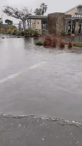 Floodwater Inundates Parking Lot in Huntington Beach