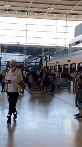 Passengers Stand in Long Line for Departures at Berlin Airport