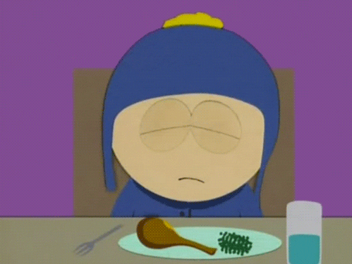 South Park gif. Craig sits at a dinner table and blinks while giving the finger to everything around him.