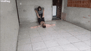 Mom Uses Son As A Squeegee To Wash The Garage GIF by ViralHog