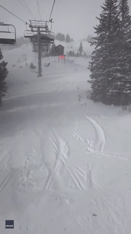 Man Documents Fallen Ski Chair While Stuck on Ski Lift