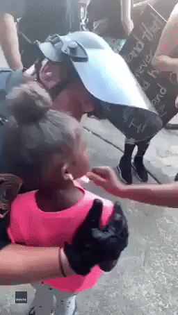 'I'm Here to Protect You': Officer Comforts Scared Girl at Houston Protest