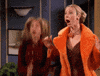 Friends gif. Jennifer Aniston as Rachel and Lisa Kudrow as Phoebe jump up and down, clapping their hands and screaming with excitement. 