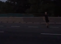 Family Plays Football in Middle of Motorway During Severe Traffic Congestion