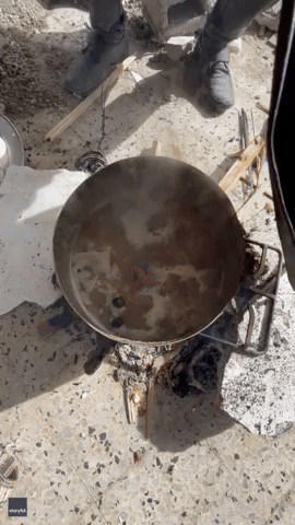 Palestinians Cook Amid the Ruins in Khan Yunis