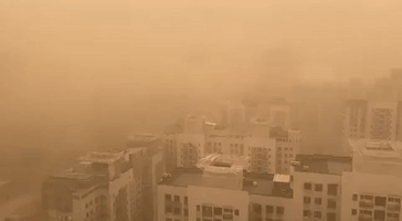 Beijing Shrouded in Orange as Sandstorm Sweeps In