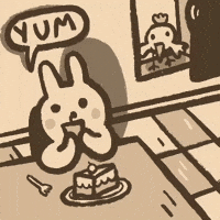 Cartoon gif. A cartoon rabbit eats a piece of cake with a speech bubble that says, “yum.”