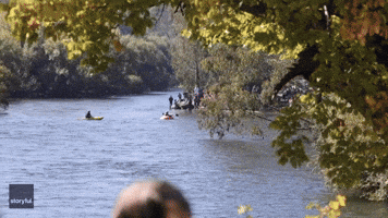 Intrepid Canoeist Paddles Giant Carved-Out Pumpkin Down River