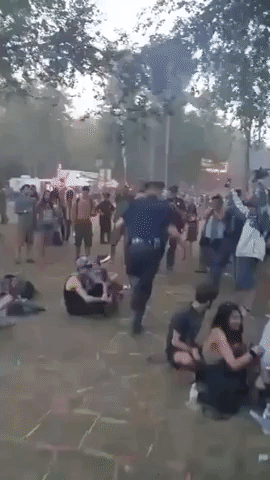 Michigan Police Officers Play Hopscotch at the Electric Forest Festival