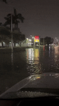 South Florida Drivers Crawl Through Flooded Streets
