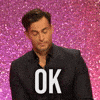 Reality TV gif. Cheyenne Jackson is guest judging on RuPaul's Drag Race and he raises his eyebrows and nods his head seriously without looking up at us and says, "Ok."