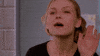 Movie gif. Kirsten Dunst as Torrance Shipman in Bring It On has a sassy look on her face as she waves her hand open and close, and says, “Buh Bye.”