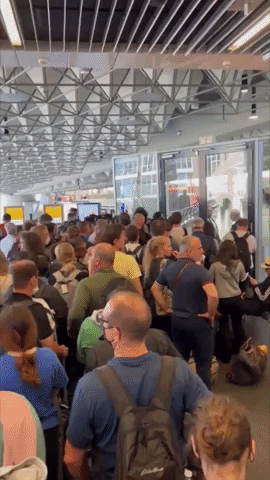 Passengers Wait in Long Lines in Frankfurt Airport