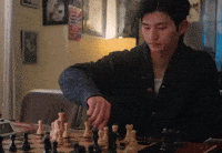 Chessboard Playing Chess GIF