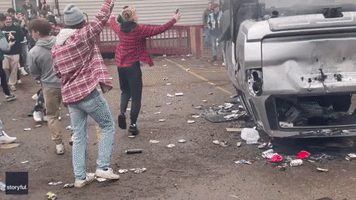 Explosion Scatters People at Street Party for MSU