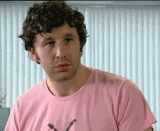 TV gif. Chris o'Dowd as Roy on the IT crowd has a shocked expression on his face and he stumbles back. He furrows his brow in confusion. 