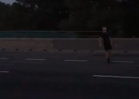 Family Plays Football in Middle of Motorway During Severe Traffic Congestion