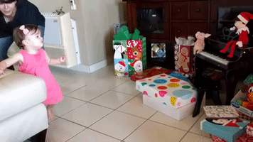 Adorable Baby Girl Reacts to Her First Christmas