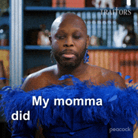Sponsored gif. Traitors cast member Bob the drag queen in a blue feathered dress looks unimpressed as they say, “My momma didn’t raise no fool.” Text also reads, “My momma didn’t raise no fool.”